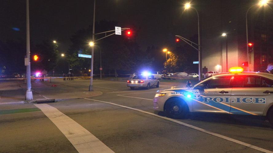 LMPD near old Greyhound Bus Station in Louisville after shooting on W. Muhammad Ali Blvd.