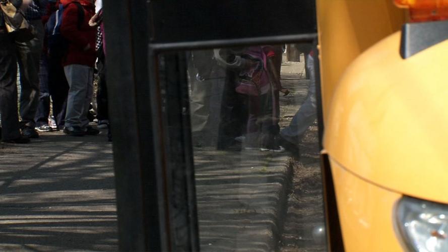 Kids getting on school bus generic.jpg