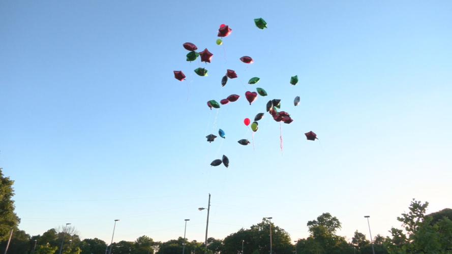 LOGAN HOMICIDE VICTIM BALLOON RELEASE _42683.jpeg