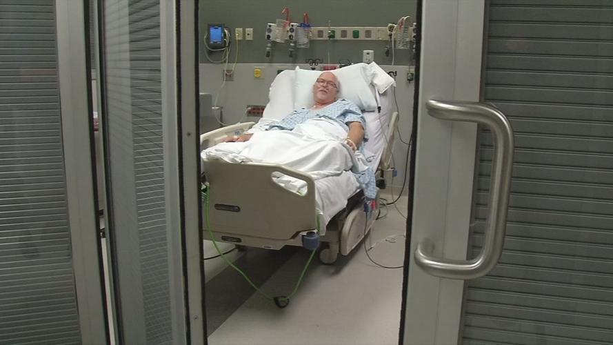 Mike Olsen (double lung transplant recipient) in hospital bed