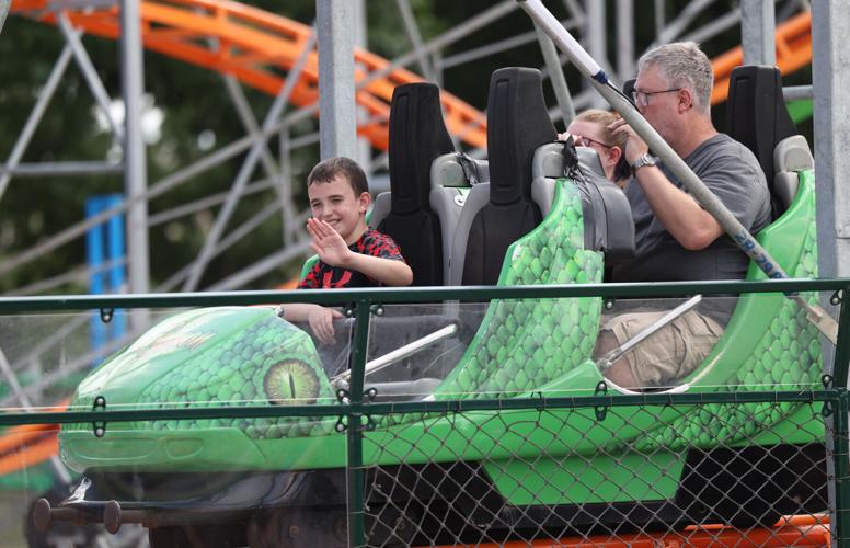 People ride on ride at the Midway