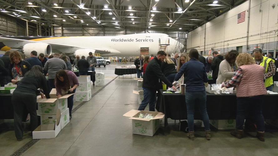 UPS employees packing hygiene kits for the homeless on April 19, 2022