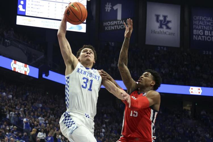 Kentucky's Kellan Grady shoots while defended by Mississippi's Luis Rodriguez.jpeg