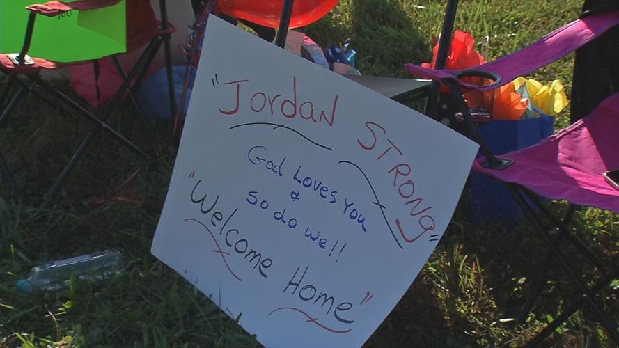 Sign for Jordan Young during welcome home parade