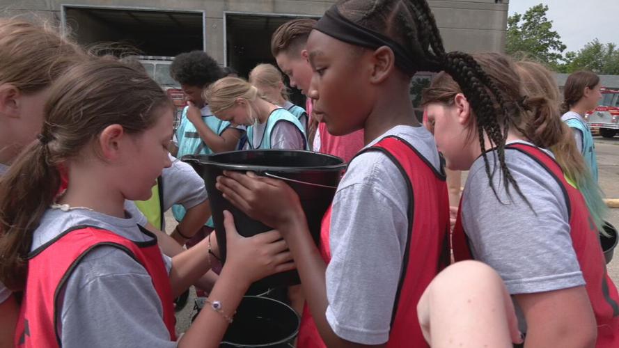 Around two dozen young girls participate in the third annual Lesley Prather Empowerment Camp at the Louisville Fire Training Academy