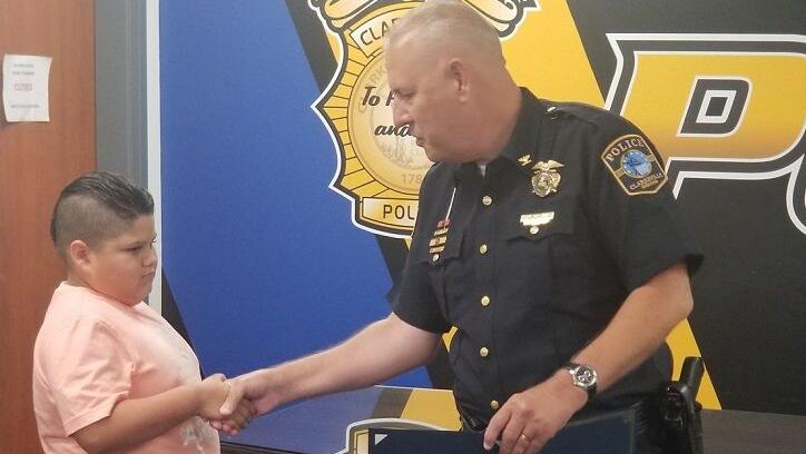 Clarksville PD Chief Mark Palmer give Carter Sparks Life Saving Award - 8.4.23