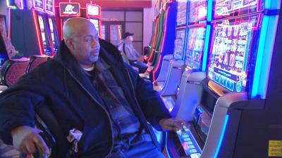Derby City Gaming player at machine