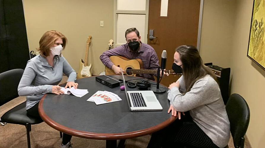Cancer survivor Kimberly Landrum (at left) writes her own song as part of music therapy