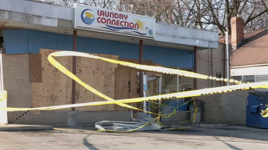 Laundry Connection on Southgate Avenue remains open, but damaged, after car crashes into building. (WDRB photo)
