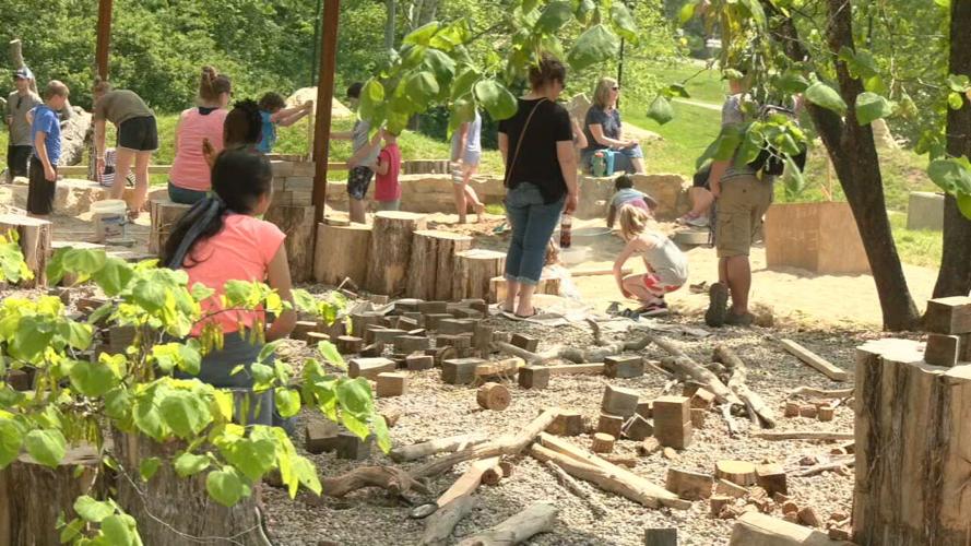 Children play at a playground at Bernheim Forest