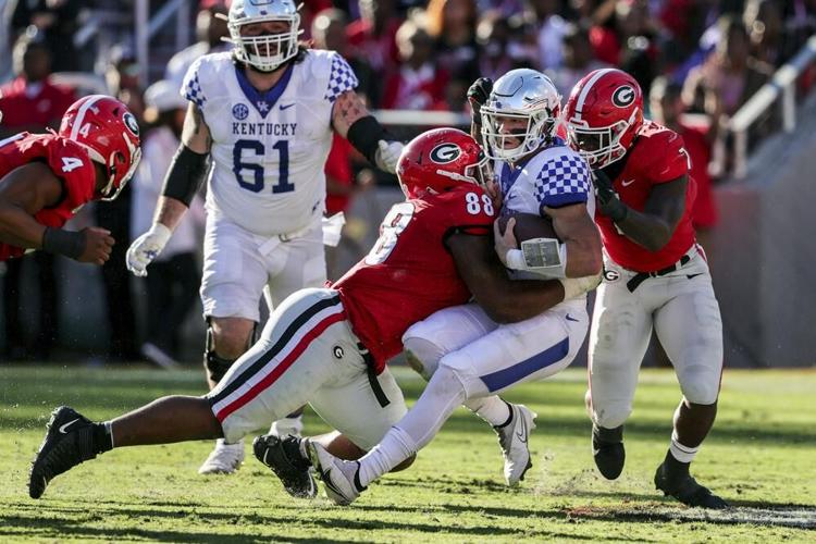 Kentucky quarterback Will Levis sacked by Georgia defense.jpeg
