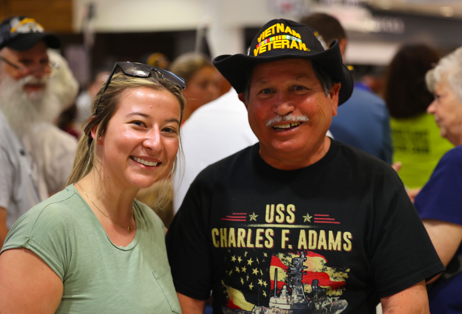 Veteran and woman pose for photo at Honor Flight Return Home.JPG