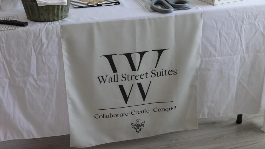 Wall Street Suites signage