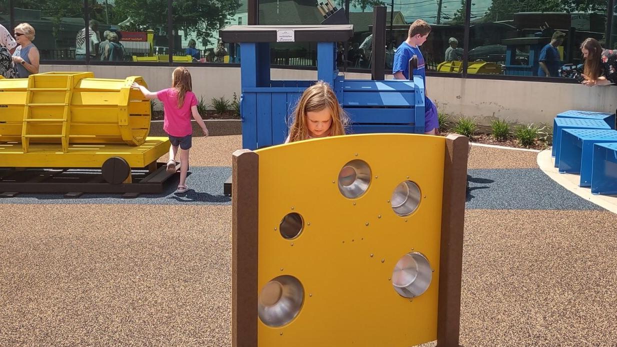 kids playing at the newly finished pocket park at Jeffersonville library