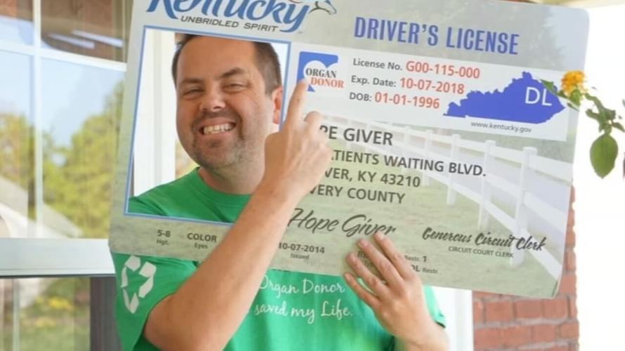 Jamie Via with oversized organ donor ID