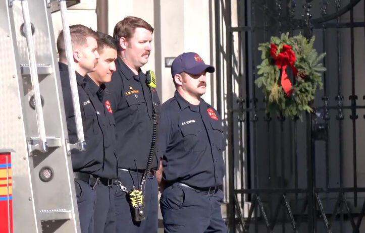 Cottongim procession - fire crew shows respect.jpg