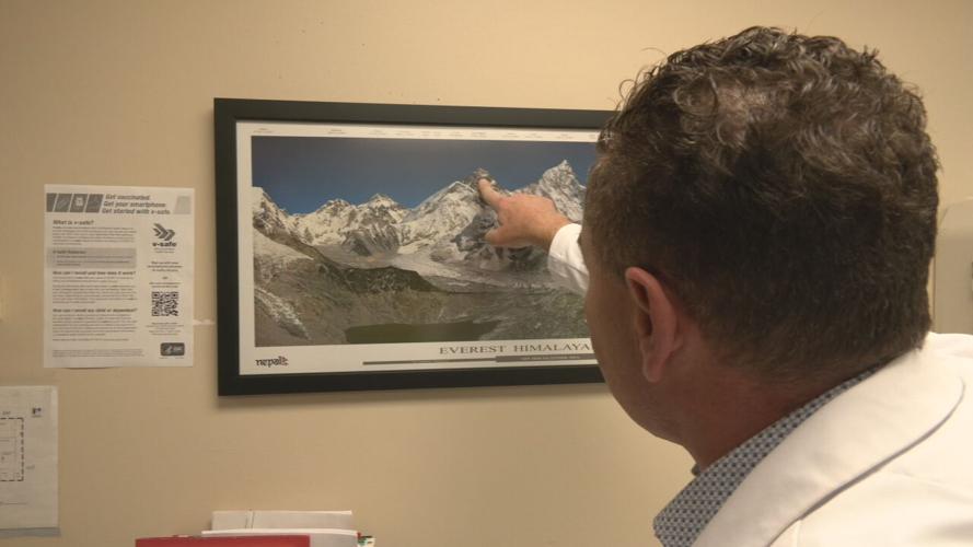 Dr. Victor Shpilberg points to Mt. Everest.jpeg