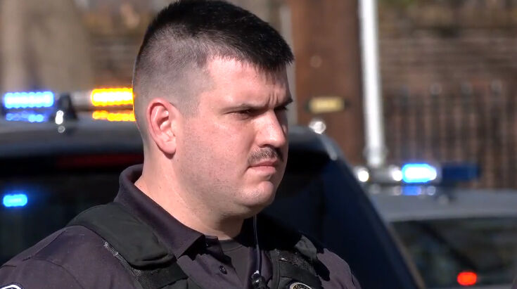 Cottongim procession - LMPD officer.jpg