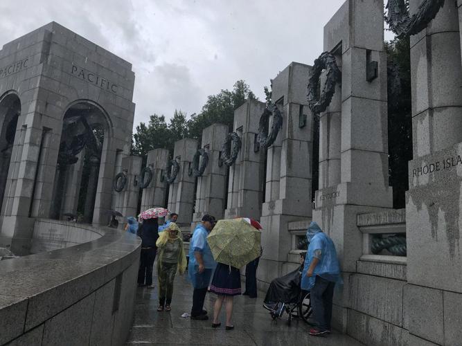 Honor Flight Bluegrass Vets with Umbrellas