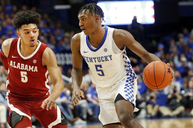 Kentucky's Immanuel Quickley, right, drives on Alabama's Jaden Shackelford