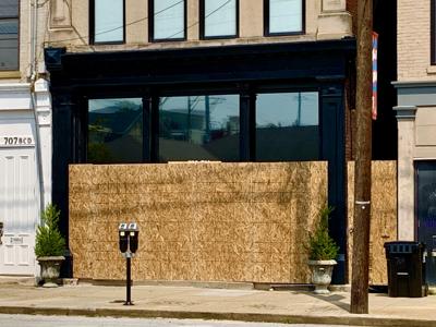 Clique Boutique NuLu temporarily closed, boarded up