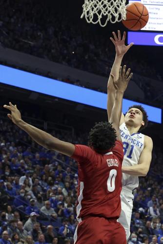 Kentucky's Kellan Grady shoots over Alabama's Noah Gurley during the first half.jpeg