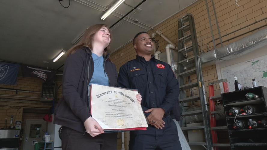 Madeline Bridges with Donovan Sims at Louisville Fire Station No. 9