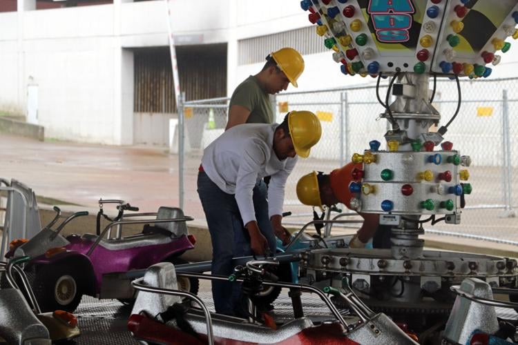 Crews set up booths along the Ohio River one day before Thunder Over Louisville 2023