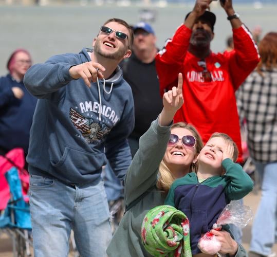 Family points toward sky.JPG