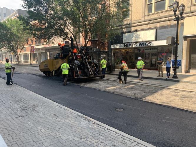 Louisville Metro Public Works crews pave a downtown Louisville road on July 26, 2023