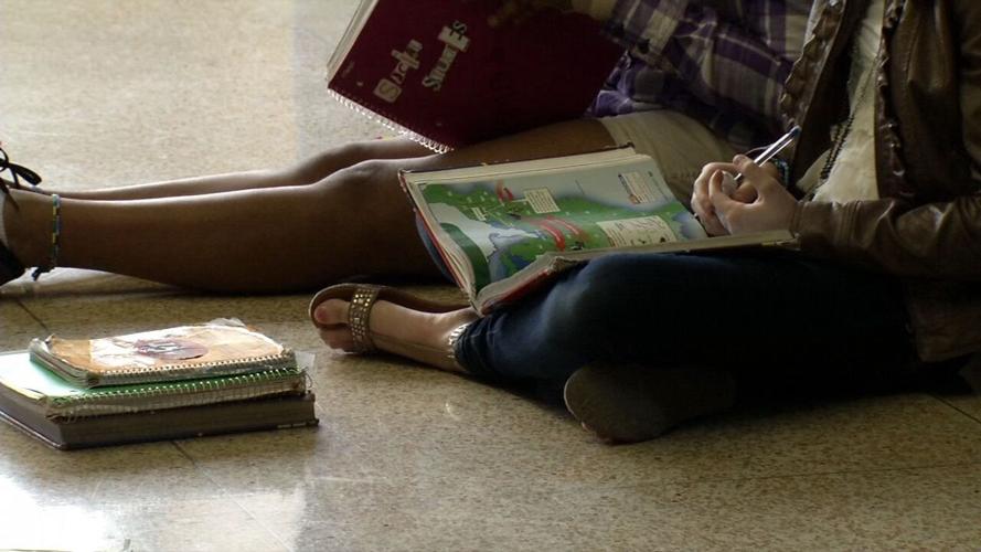 Students reading textbooks