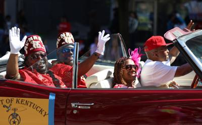 People wave to crowd at Pegasus Parade.JPG