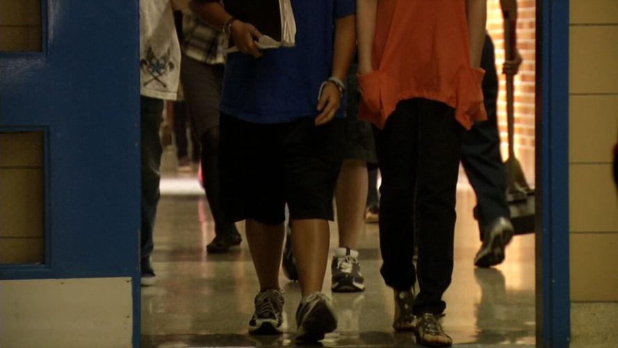 Students walking in JCPS building.jpeg