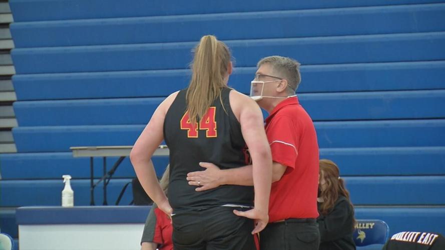 Bullitt East head coach Chris Stallings talks with junior center Gracie Merkle