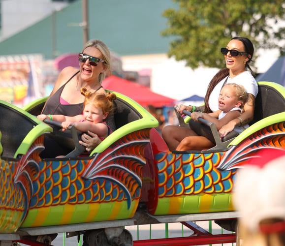 Women and children ride at Kentucky State Fair.JPG