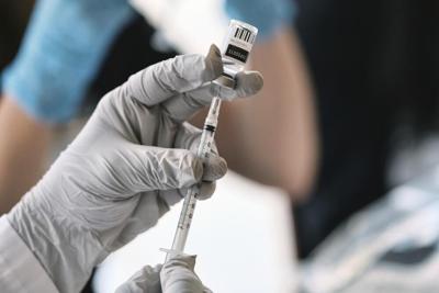 Syringe drawing Monkeypox vaccine from vial