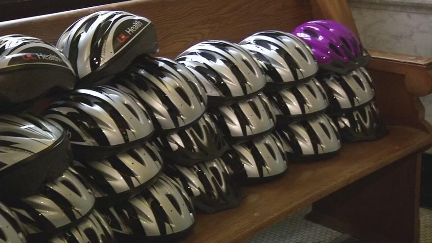 UofL Health bike helmet donation to KY Refugee Ministries (2).jpeg