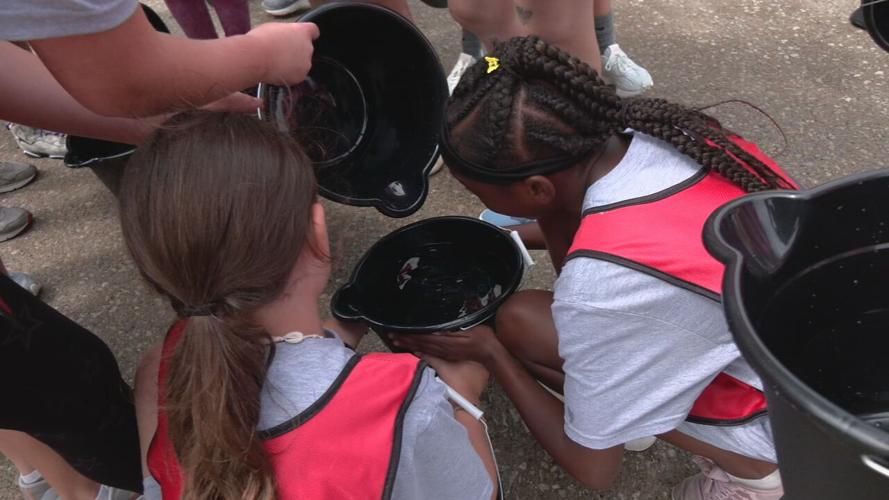Around two dozen young girls participate in the third annual Lesley Prather Empowerment Camp at the Louisville Fire Training Academy
