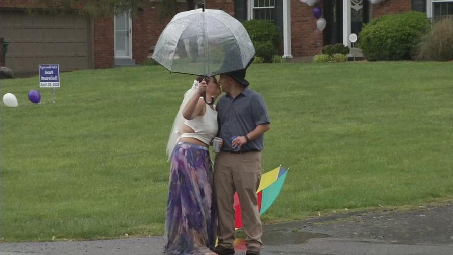 Katie and Ryan Loveall kiss after COVID-19 pandemic porch wedding