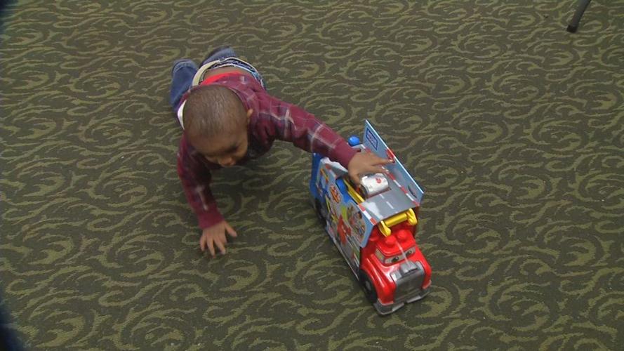 Child Plays with Toy at Miracle on Broadway - 12-17-19