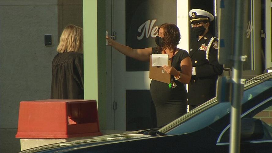 New Albany High School grad gets temperature checked