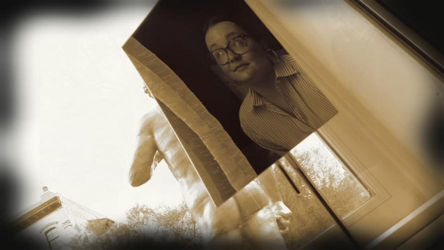 Photograph obscures view of David statue outside 21C window in downtown Louisville