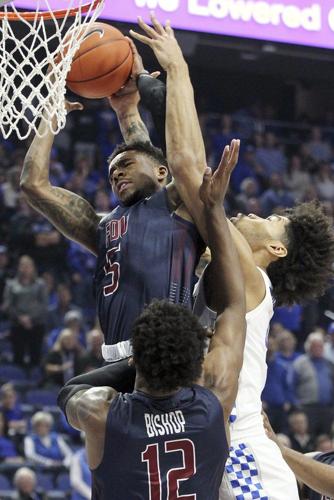 Fairleigh Dickinson's Xzavier Malone-Key (5) pulls down a rebound near Kentucky's Nick Richards