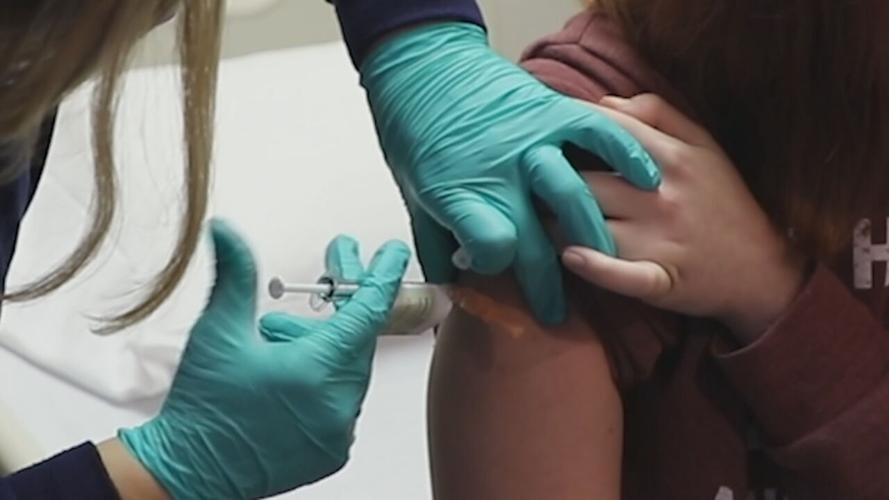 Person receiving COVID-19 coronavirus vaccine (generic)