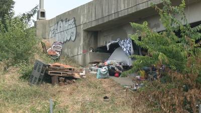 Tents set up underneath Louisville overpass