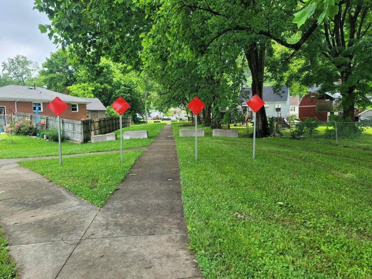 Safety barricade installed around walkway in Beechmont neighborhood to