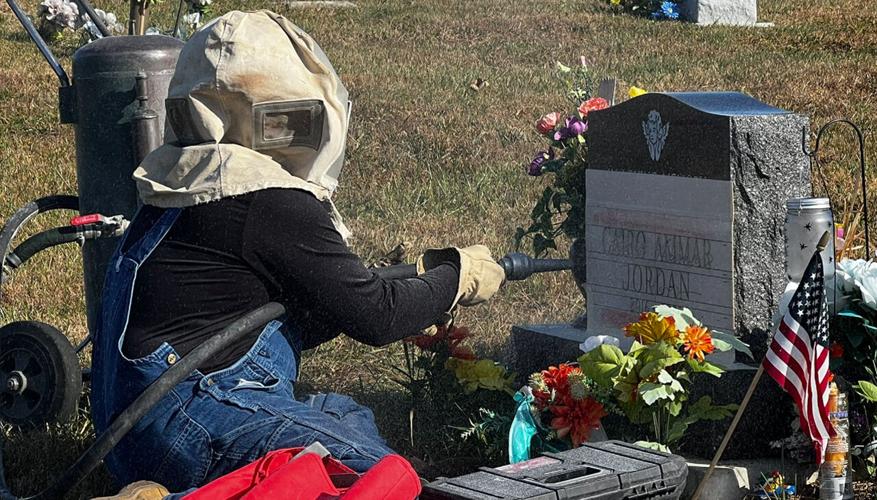 Corey Churchman of Marshall Monuments engraving Cairo Ammar Jordan's name onto his tombstone