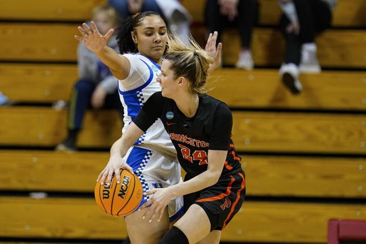Princeton guard Julia Cunningham makes a pass around Kentucky guard Treasure Hunt.jpeg