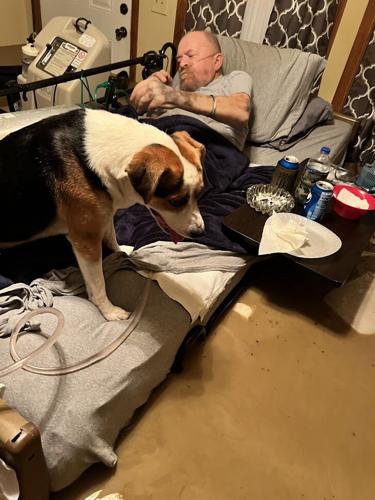 Isaac Eversole waits to be rescued as water rises around him during eastern KY floods