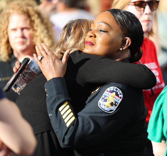 LMPD Chief Jackie Gwinn-Villaroel shares a hug.JPG